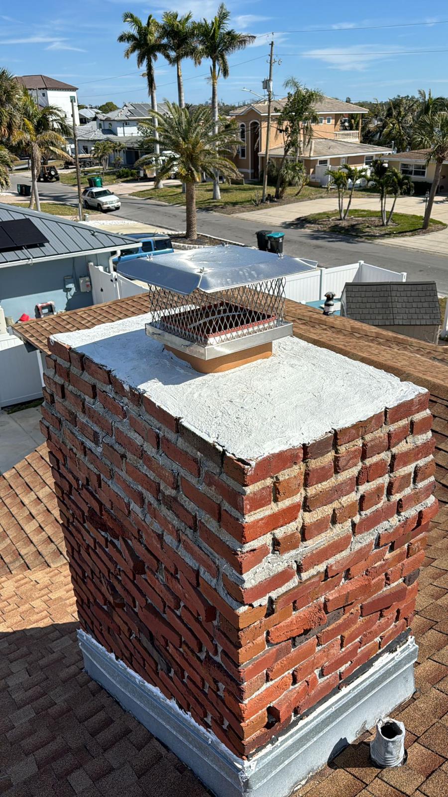 Finished Brick Chimney on Roof in Tampa, FL Finished brick chimney on roof in Tampa, FL